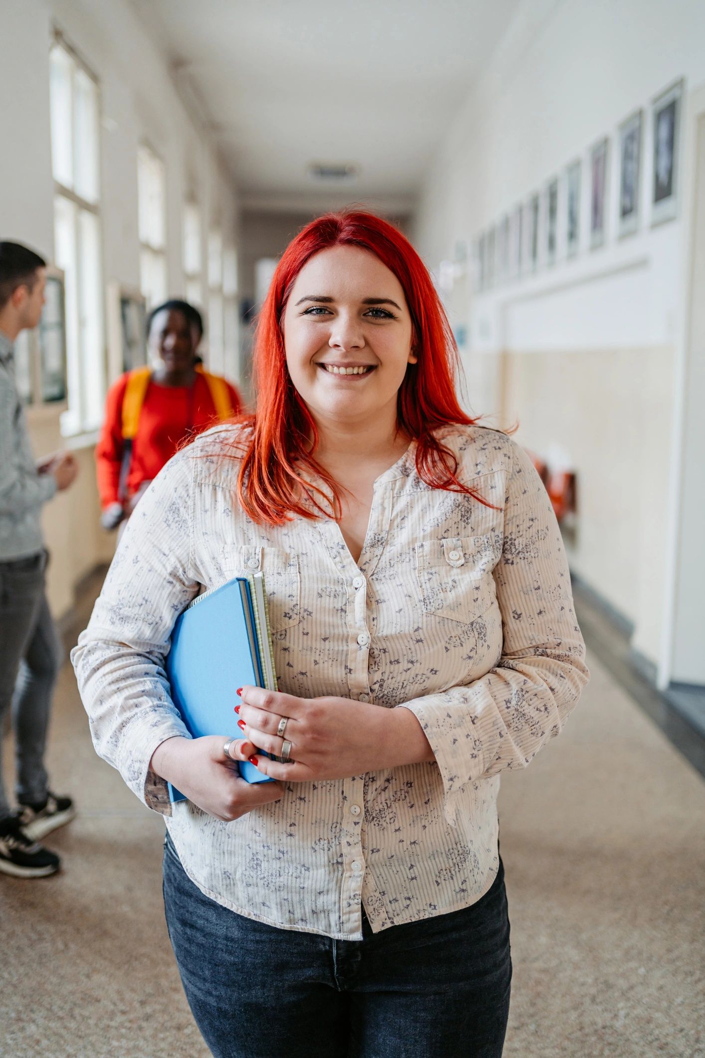 Portrait of a young female student in a college hall